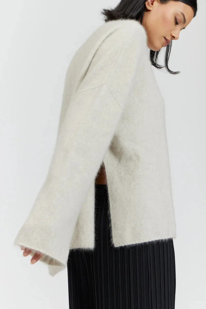 There Elsewhere Mock Neck Side Slit Sweater